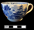 Pearlware printed underglaze bute-shaped cup in Chinese motif. 18BC38